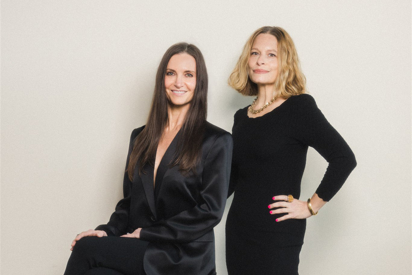 Black and white portrait of two women smiling women