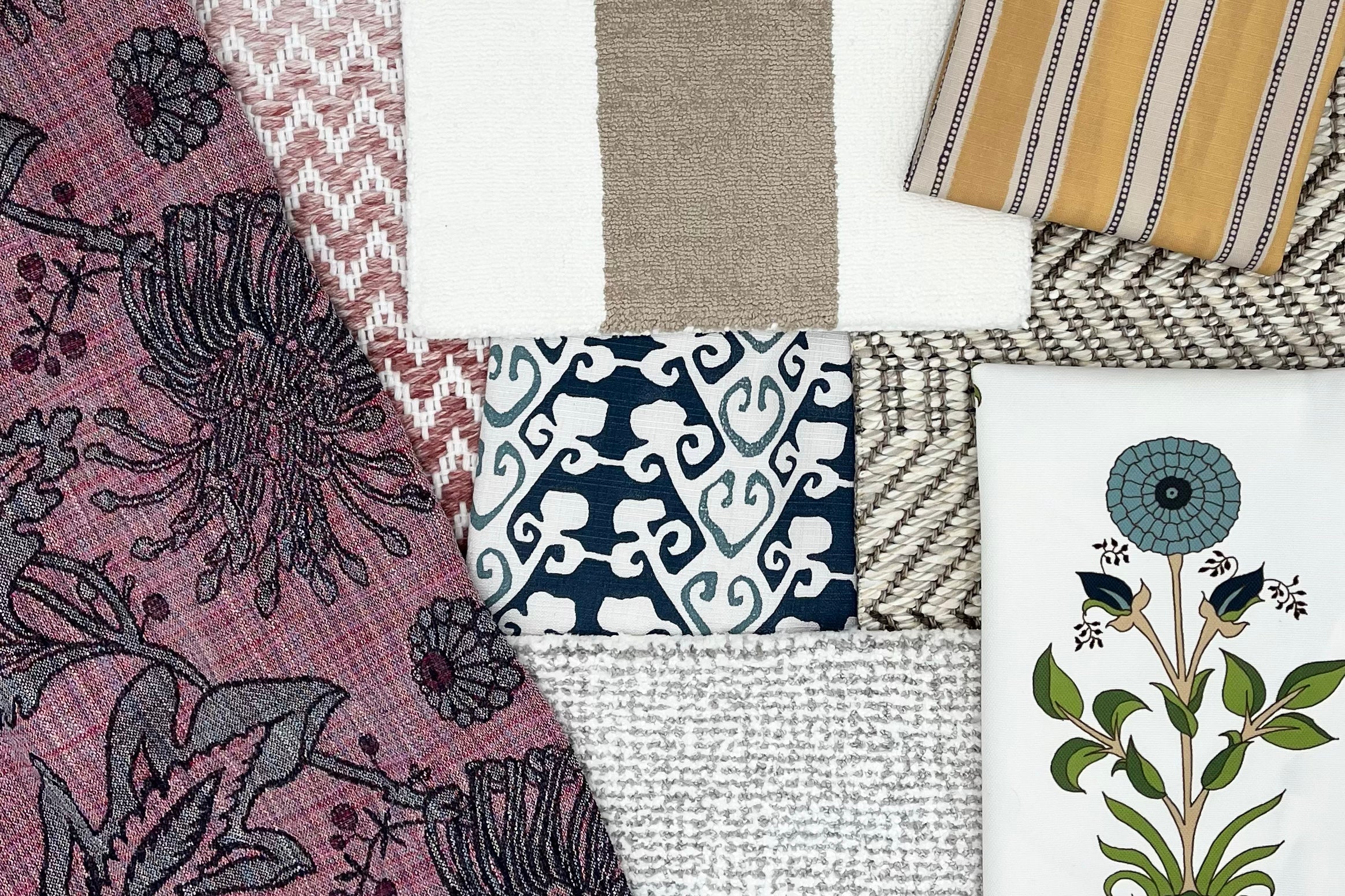 A collage of fabrics and rug samples in a mix of florals, stripes, geometric and textural designs.