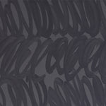 Detail of wallpaper in a playful paint print in charcoal on a gray field.