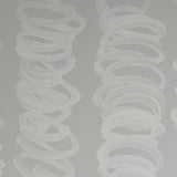 Detail of wallpaper in an abstract scribble print in light gray on a gray field.
