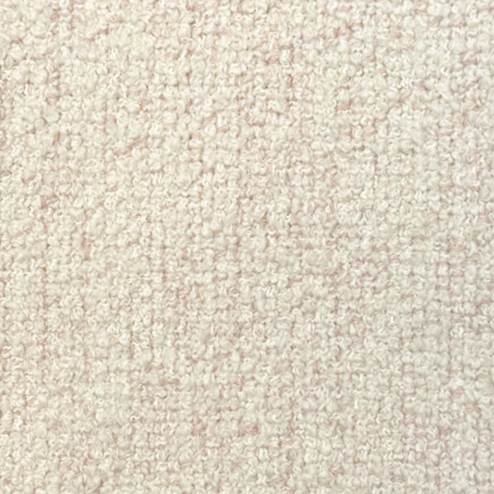 Broadloom carpet in cream bouclé with pink accents. 