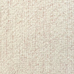 Broadloom carpet in cream bouclé with pink accents. 