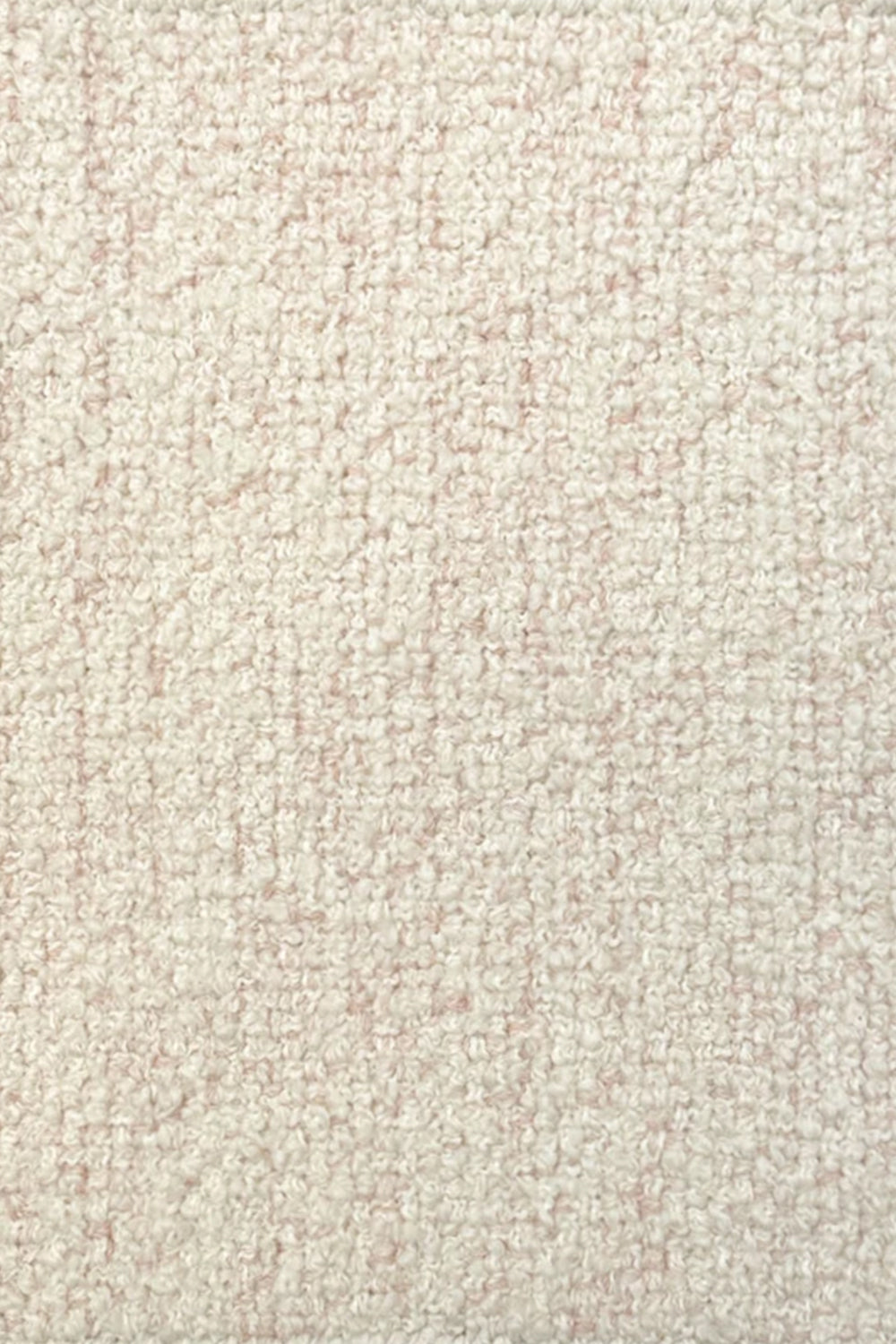Broadloom carpet in cream bouclé with pink accents. 