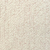Broadloom carpet in cream bouclé with pink accents. 