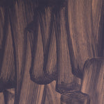 Detail of wallpaper in an abstract paint print in dark grey on a purple field.