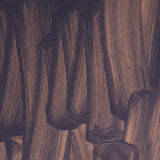 Detail of wallpaper in an abstract paint print in dark grey on a purple field.