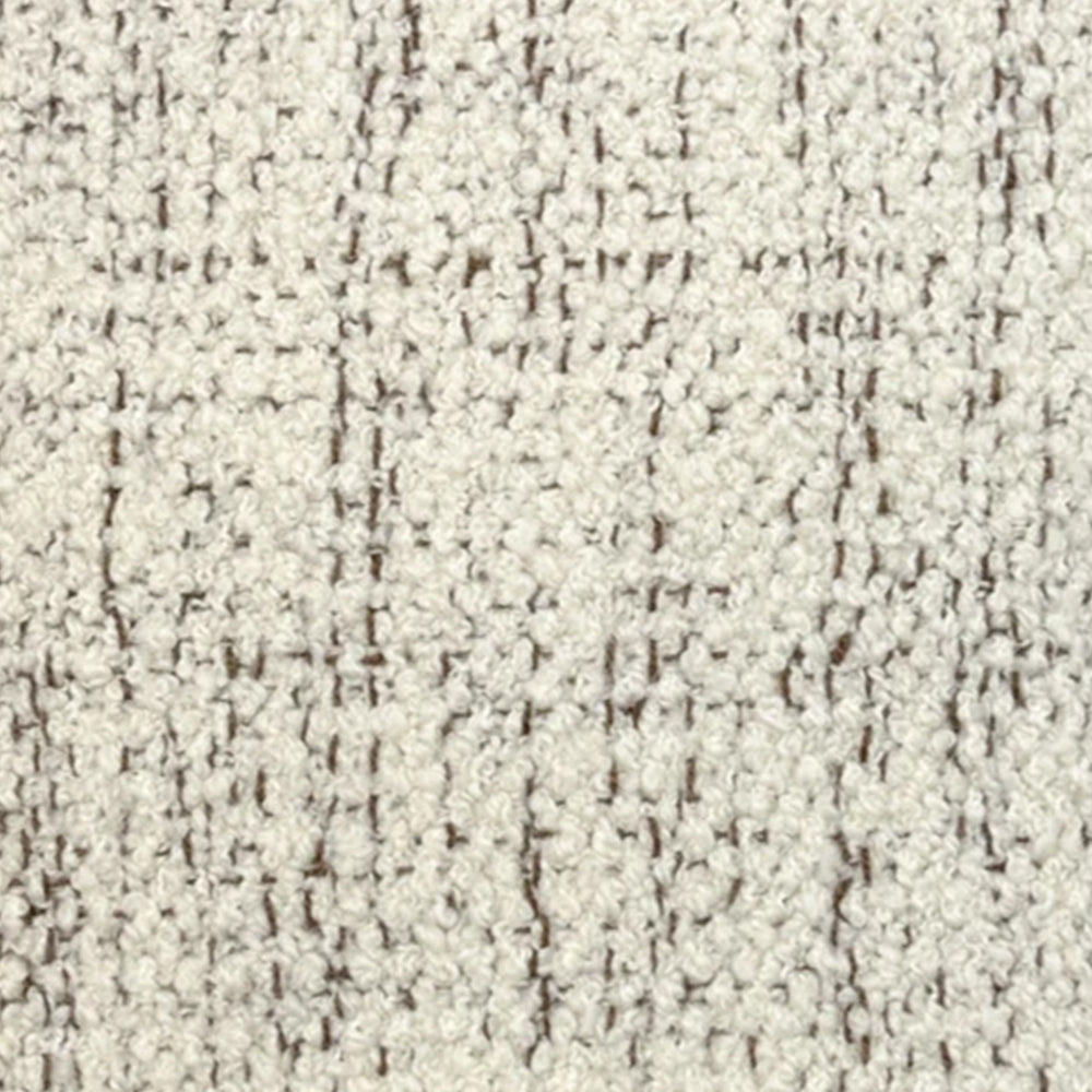 Broadloom carpet in cream bouclé with brown accents. 