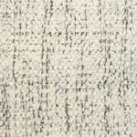 Broadloom carpet in cream bouclé with brown accents. 