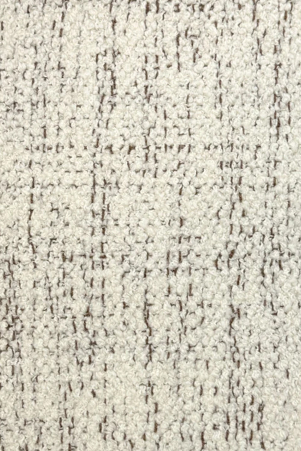 Broadloom carpet in cream bouclé with brown accents. 
