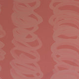 Detail of wallpaper in an abstract scribble print in pink on a dark pink field.