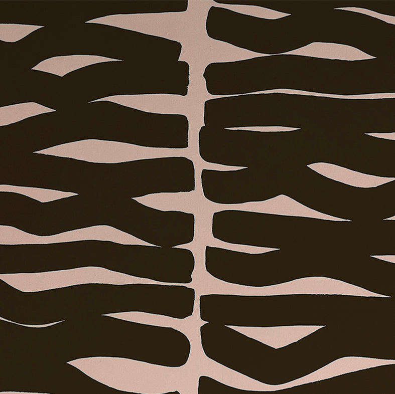 Detail of wallpaper in an abstract zigzag pattern in black on a light pink field.