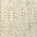 Broadloom carpet in cream bouclé with tan accents. 
