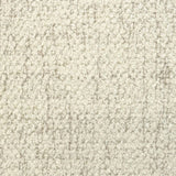 Broadloom carpet in cream bouclé with beige accents. 