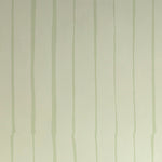 Detail of wallpaper in a playful irregular stripe print in light green on a cream field.