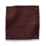 Wool boucle swatch pinned in all corners in wine red