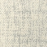 Broadloom carpet in cream bouclé with grey accents. 