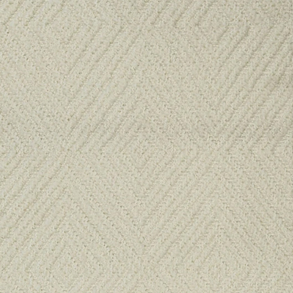 Broadloom carpet with dimensional diamond pattern in cream.