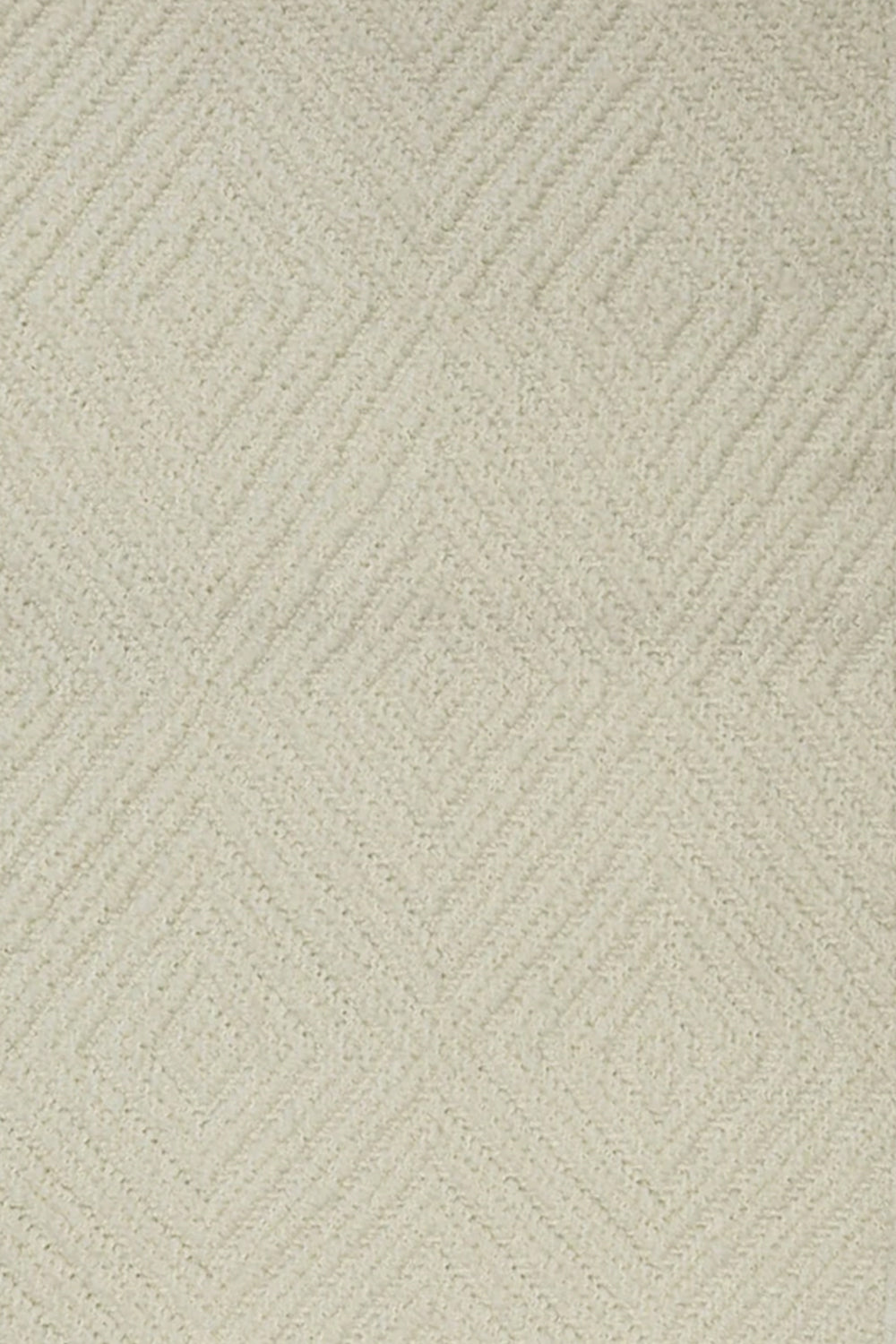 Broadloom carpet with dimensional diamond pattern in cream.
