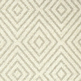 Broadloom carpet with dimensional diamond pattern in cream with beige. 