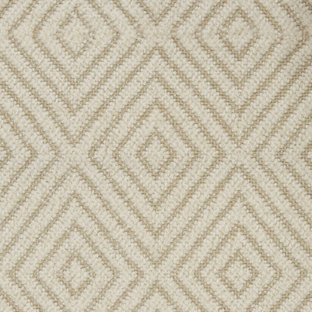 Broadloom carpet with dimensional diamond pattern in cream with tan. 