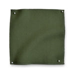 Wool sateen swatch pinned in all corners in moss green