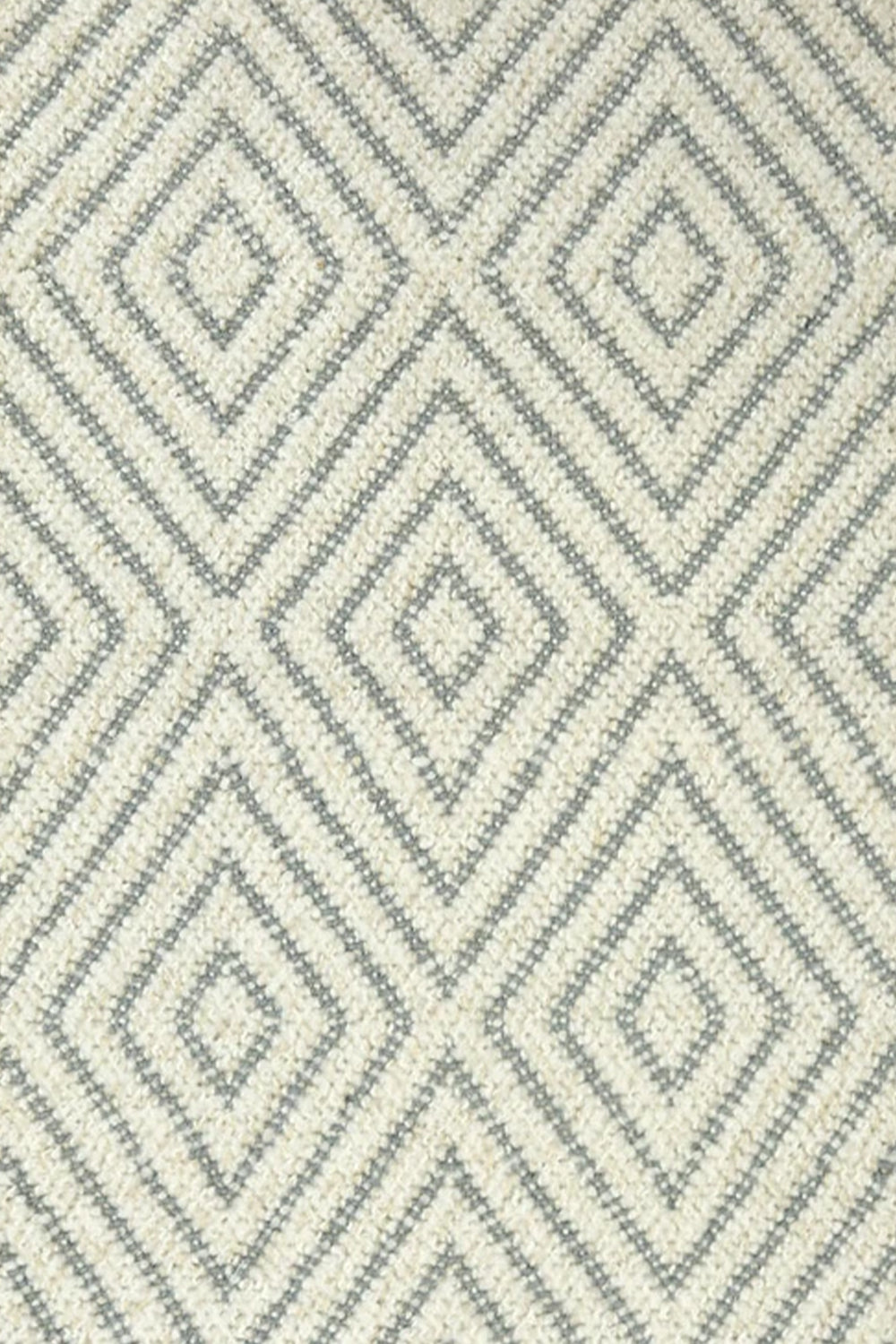 Broadloom carpet with dimensional diamond pattern in cream with grey.