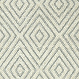 Broadloom carpet with dimensional diamond pattern in cream with grey.