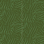 Wallpaper panels in a playful broken stripe print in dark green on a green field.
