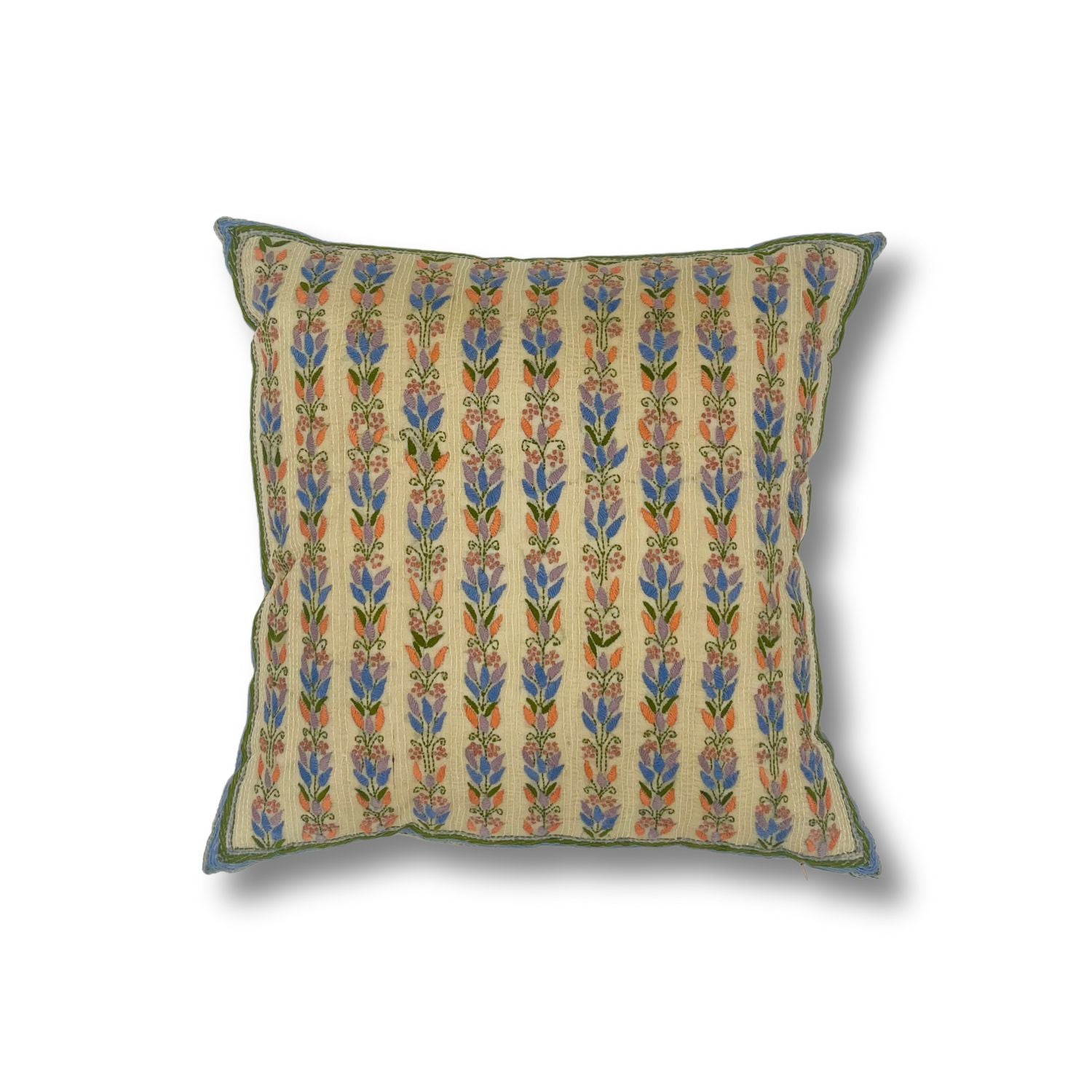 Throw pillow with printed and embroidered floral stripe design in pastel pink, purple and blue and green accents on a white field. 