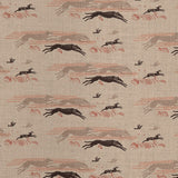 Detail of fabric in a running whippet print in shades of brown, red and gray on a tan field.