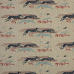 Detail of fabric in a running whippet print in shades of navy, blue and red on a tan field.