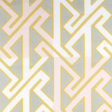 Detail of wallpaper in a contemporary lattice print in pink, cream and yellow on a gray field.