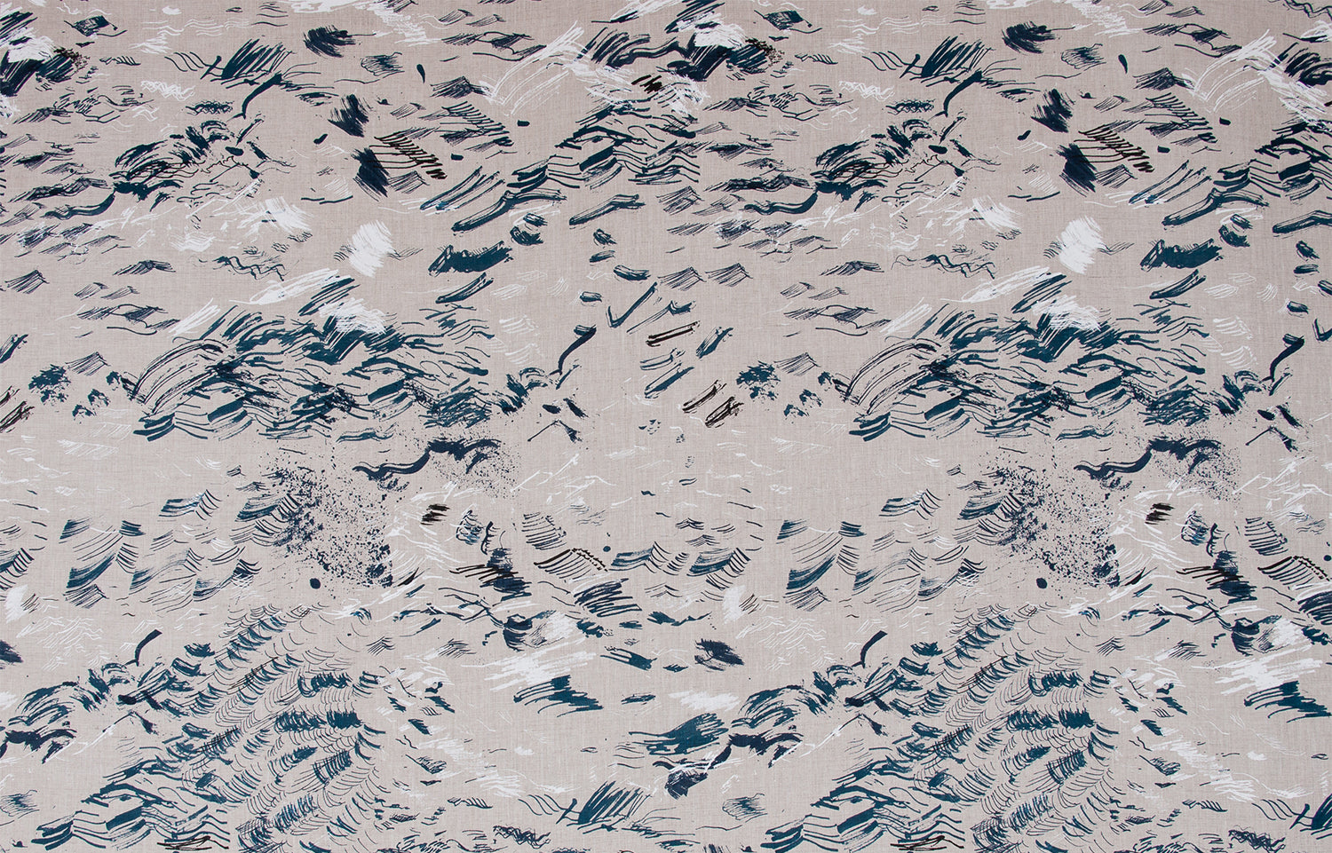 Detail of fabric in a painterly seaside print in navy and white on a tan field.