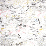 Detail of fabric in a painterly seaside print in gray and pastels on a white field.