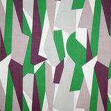 Detail of fabric in an abstract geometric print in gray, green, purple and white.