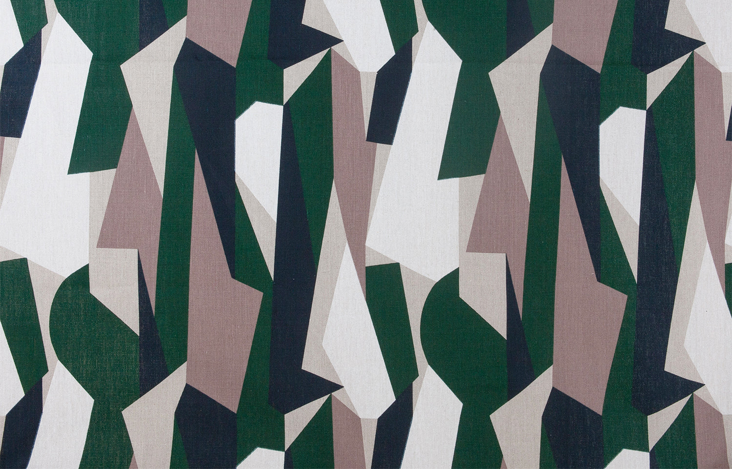Detail of fabric in an abstract geometric print in blue, green, white and tan.