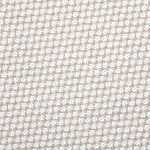 Detail of fabric in a dense geometric print in gray, white and cream.