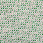 Detail of fabric in a dense geometric print in gray, green and cream.