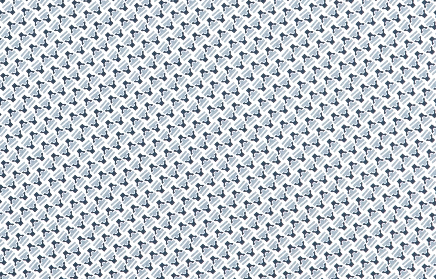 Detail of wallpaper in a dense geometric print in gray, blue and cream.