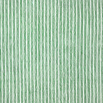 Detail of fabric in a wiggly stripe print in green on a white field.