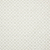 Detail of fabric in a small-scale geometric grid print in white on a cream field.