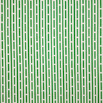 Detail of fabric in a broken line print in green on a cream field.