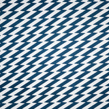 Detail of fabric in a zigzag stripe print in navy on a white field.