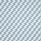 Detail of fabric in a zigzag stripe print in blue-gray on a white field.