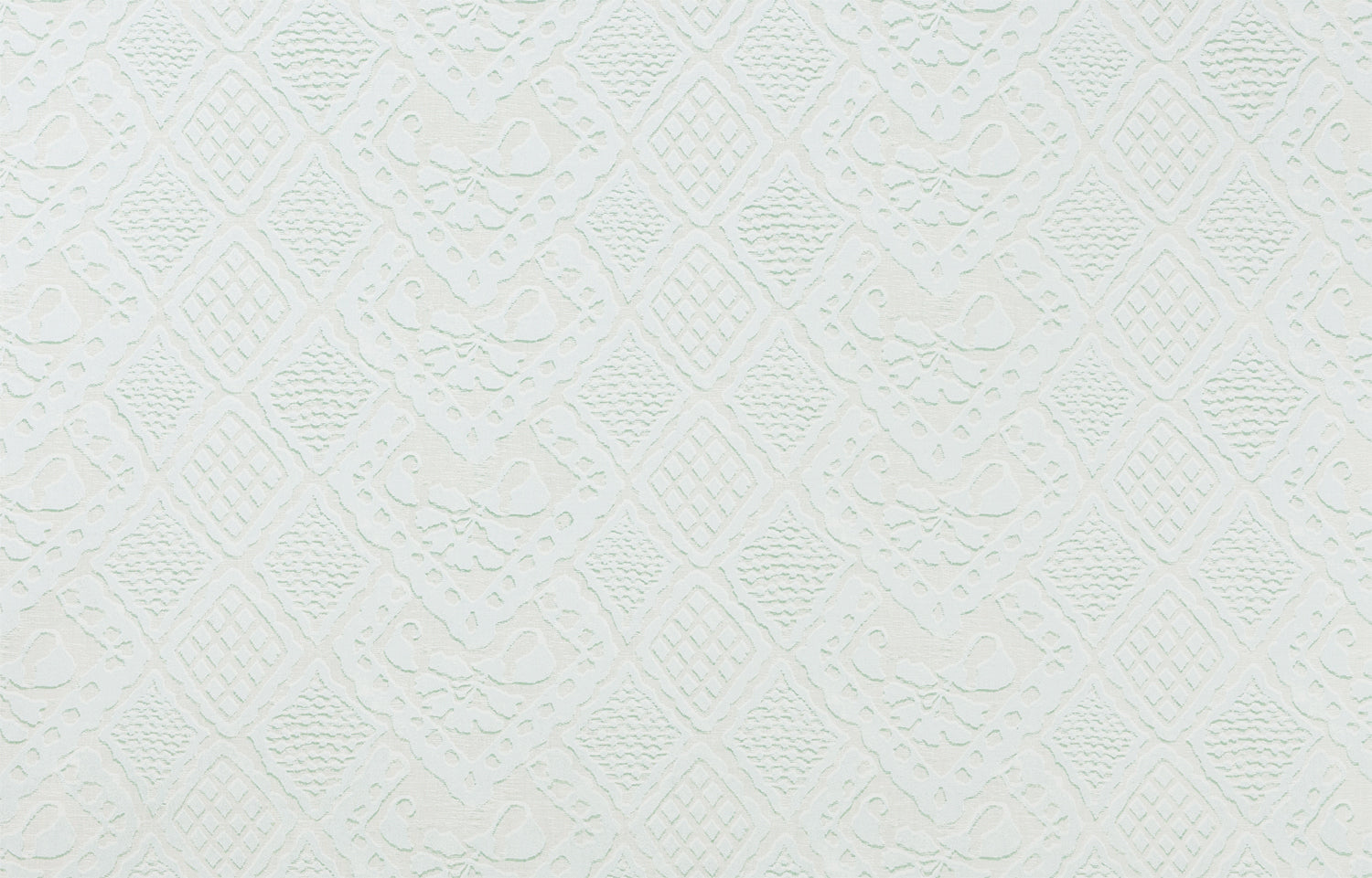 Detail of fabric in a lacey diamond print in white.