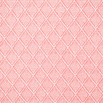 Detail of fabric in a diamond lattice print in white on a pink field.