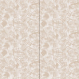 Wallpaper in an abstract paint swatch print in tan on a cream field.