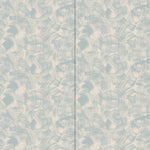 Wallpaper in an abstract paint swatch print in light blue on a tan field.