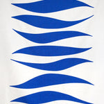Detail of fabric in an abstract wave print in blue on a white field.