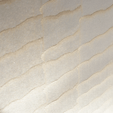 Wide-angle shot of wallpaper in an abstract textural pattern in metallic pink and cream.